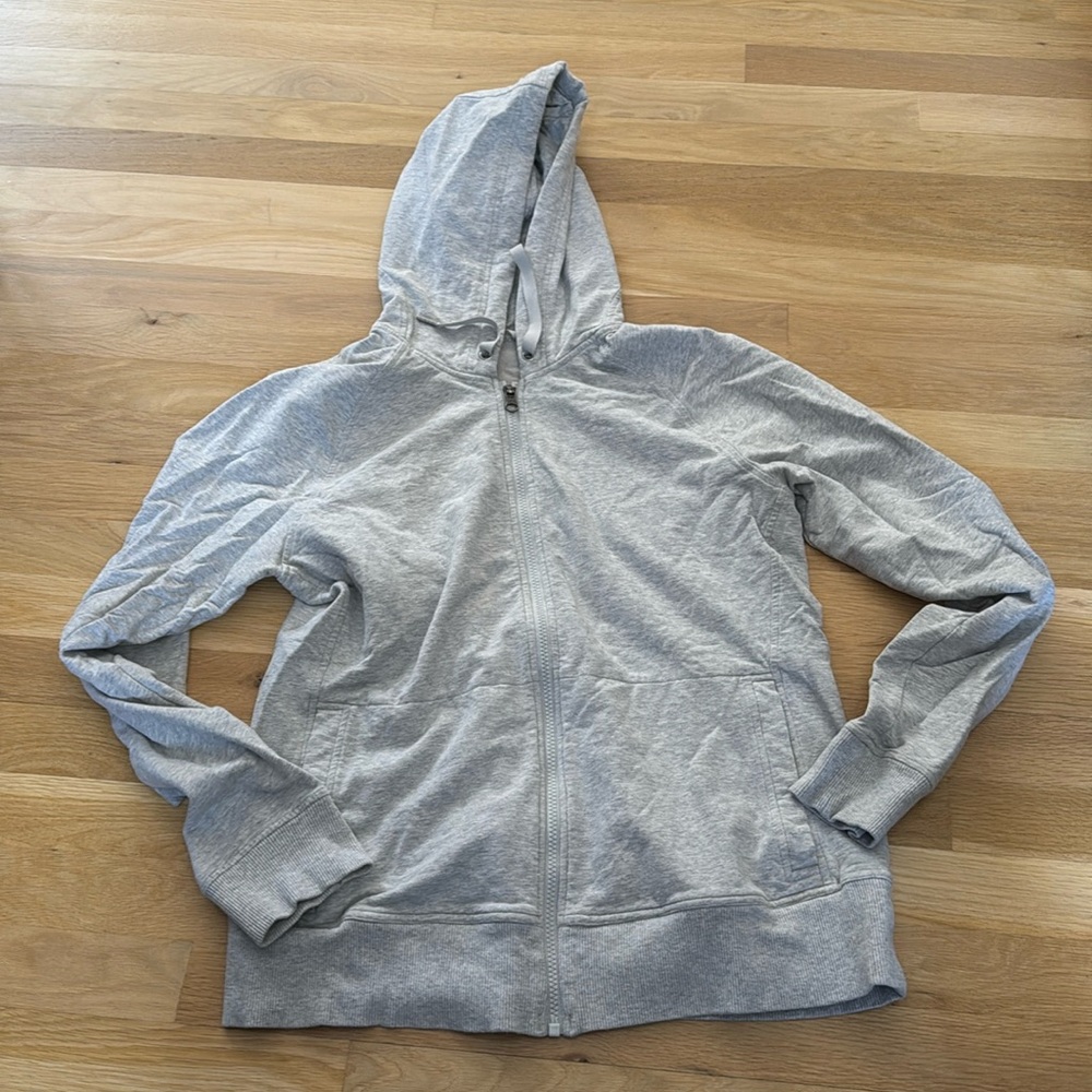 Lululemon gray zipped hooded sweatshirt. Side pockets. Size 12.
